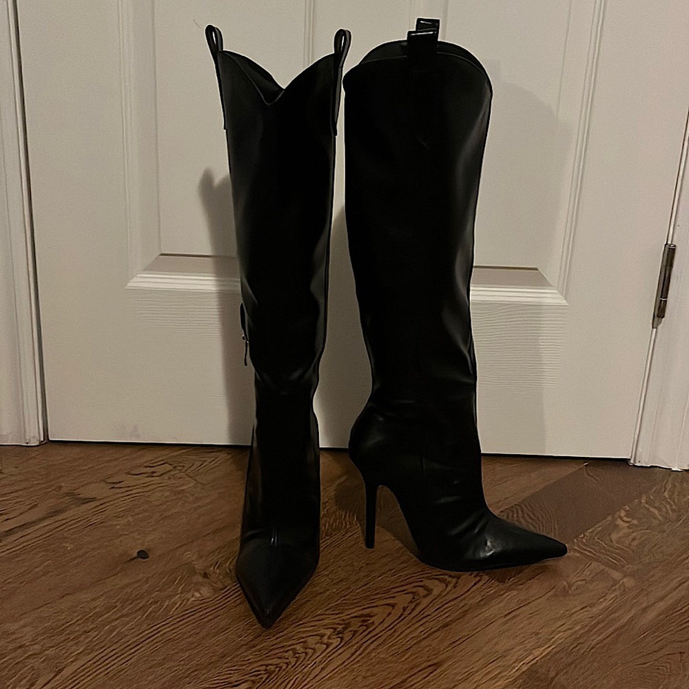 Knee high black heeled boots
